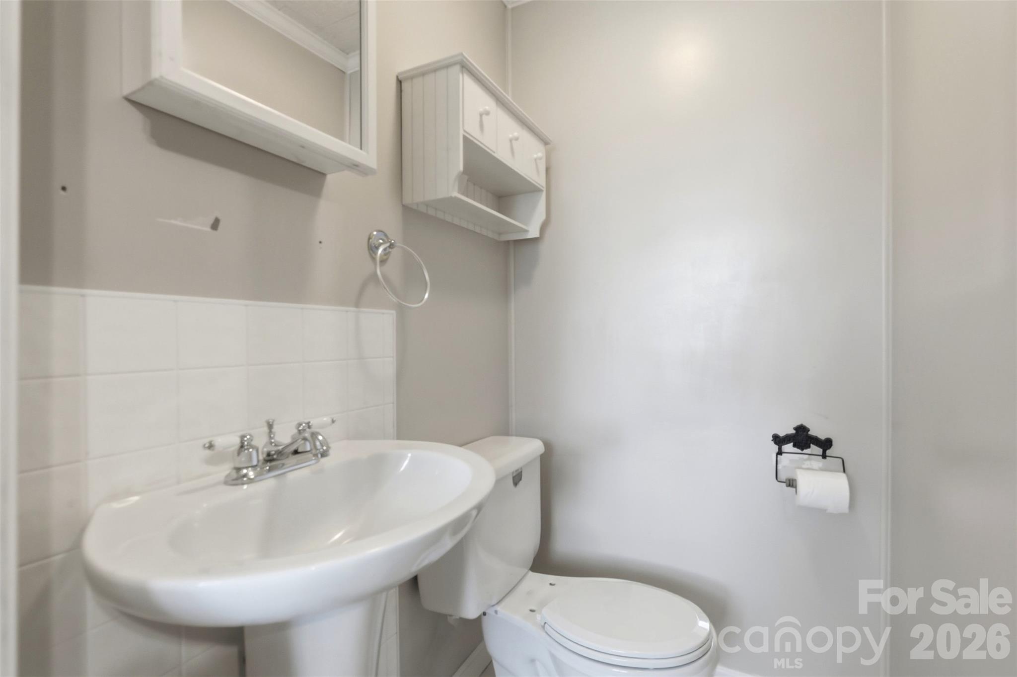 2670 North Olivers Road Newton, NC 28658 - Photo 19 of 27 a bathroom with a sink a toilet and mirror