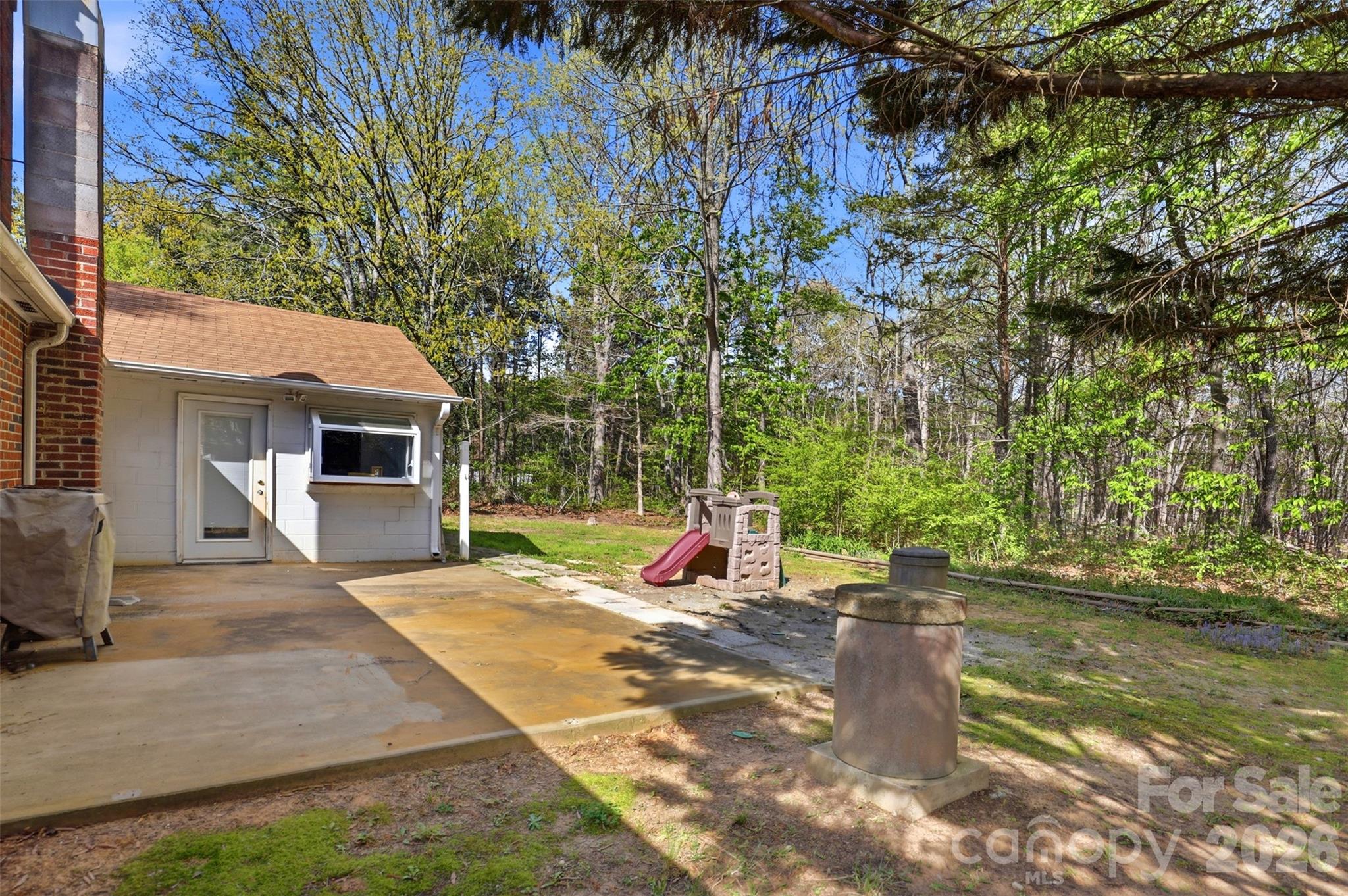 2670 North Olivers Road Newton, NC 28658 - Photo 23 of 27 a view of a house with backyard and sitting area