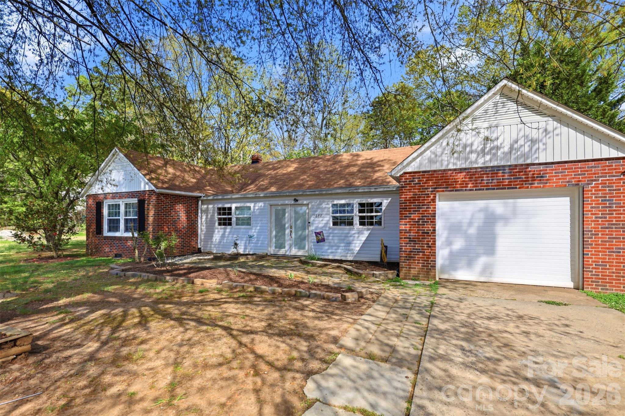 2670 North Olivers Road Newton, NC 28658 - Photo 3 of 27 a front view of a house with a yard