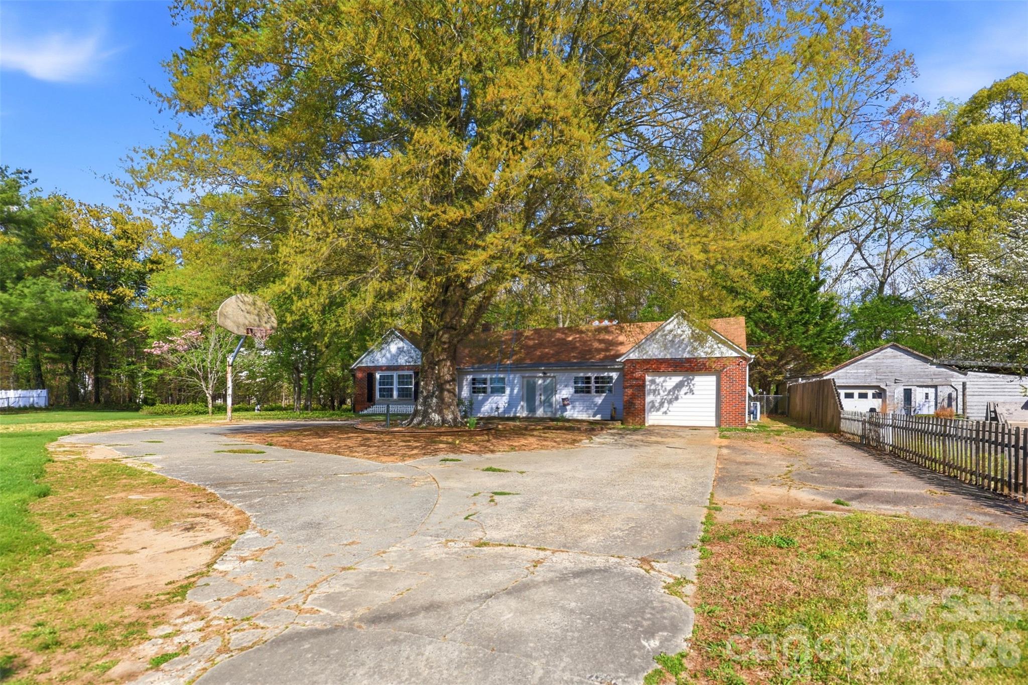 2670 North Olivers Road Newton, NC 28658 - Photo 5 of 27 a view of a house with a yard and large trees