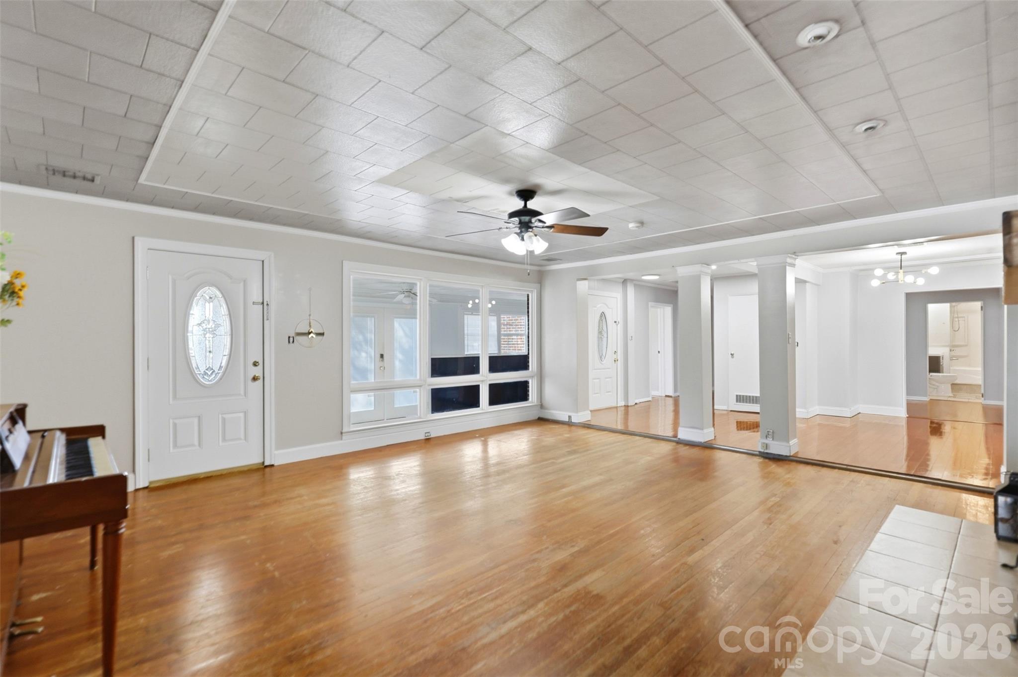 2670 North Olivers Road Newton, NC 28658 - Photo 6 of 27 a view of an empty room with window and wooden floor