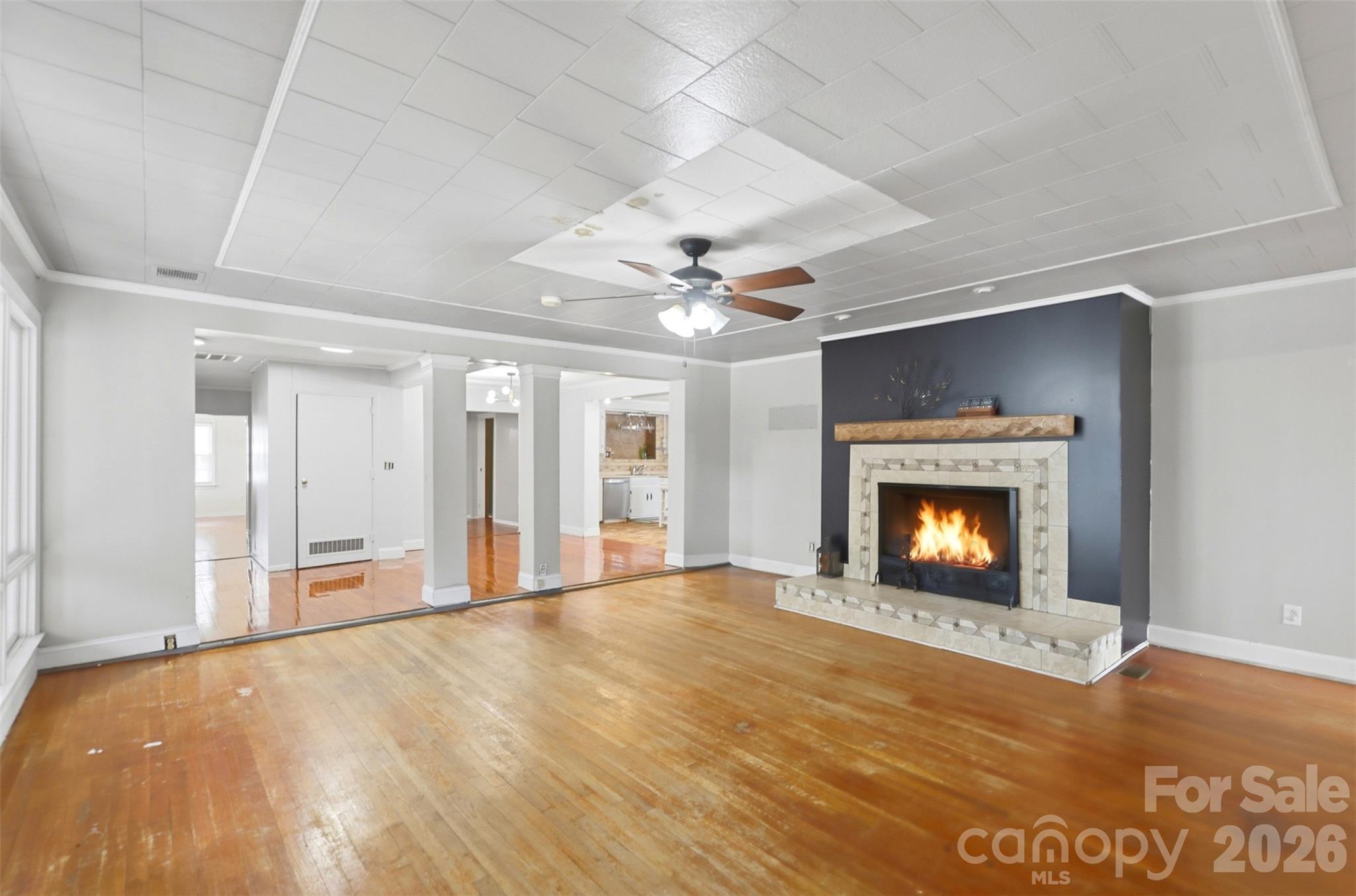 2670 North Olivers Road Newton, NC 28658 - Photo 8 of 27 a view of an empty room with a fireplace and a window