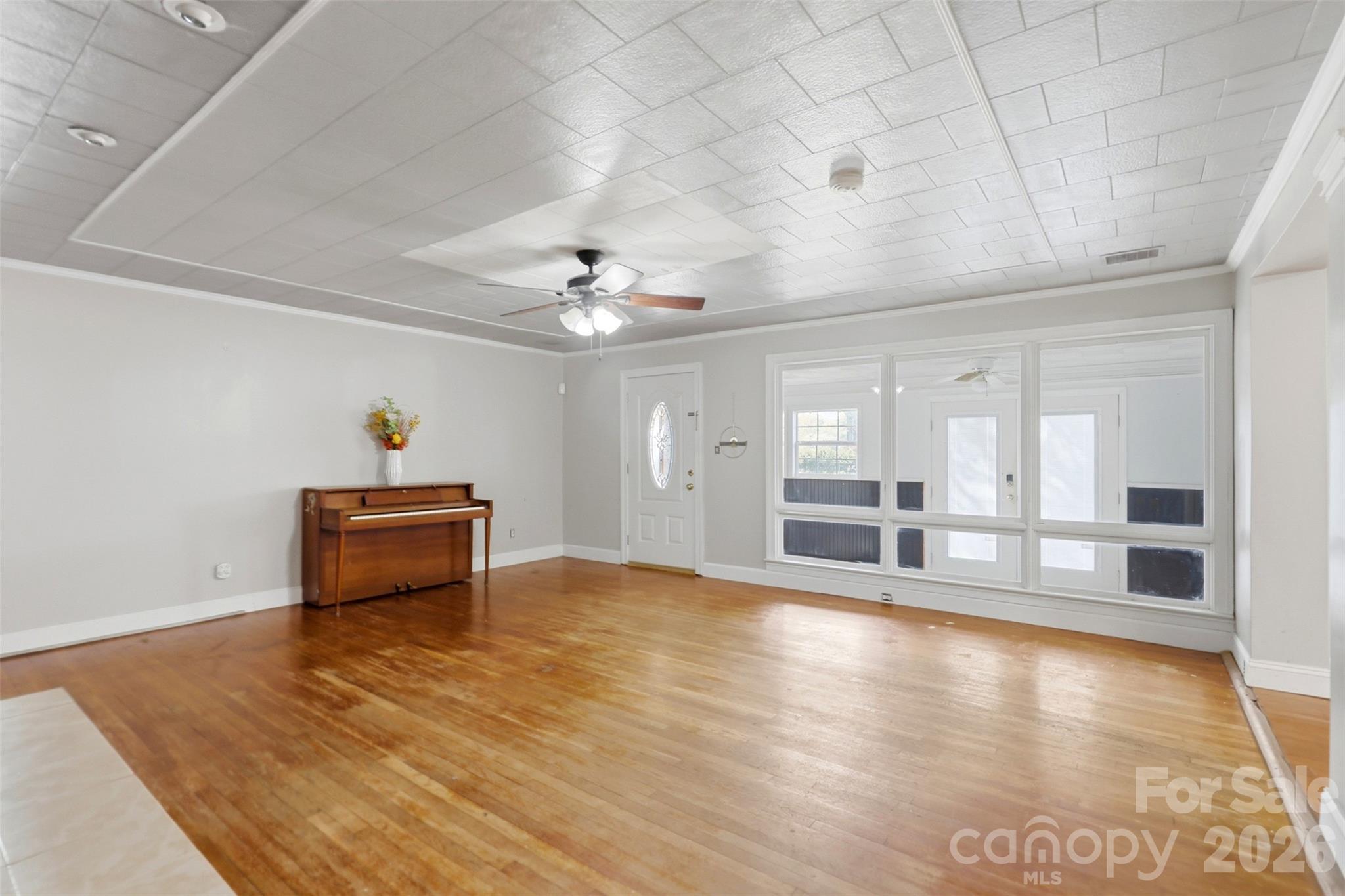 2670 North Olivers Road Newton, NC 28658 - Photo 10 of 27 a view of an empty room with window and wooden floor