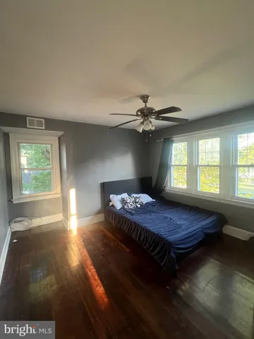 a kitchen with a sink a mirror and cabinets