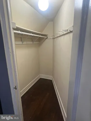 a bathroom with a sink mirror and shower