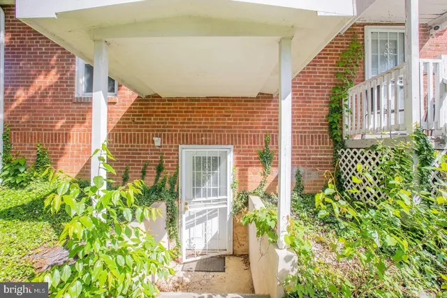 a view of a brick house with windows