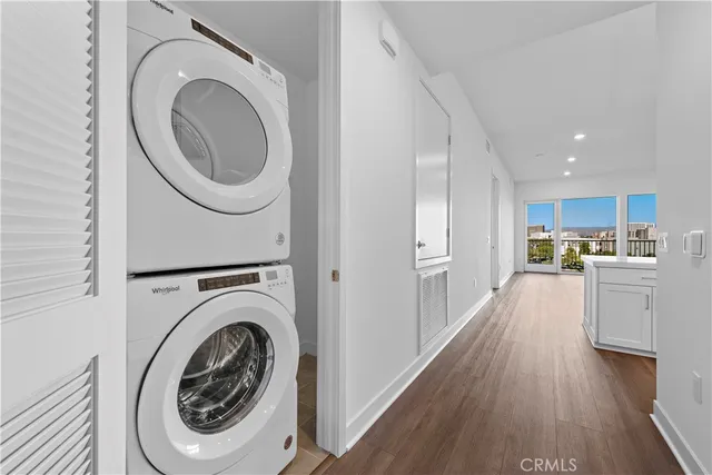 a view of a kitchen with a washer and dryer