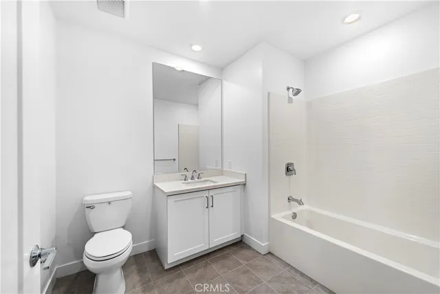 a bathroom with a toilet sink and bathtub