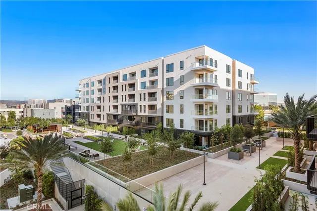 a view of a tall building from a patio