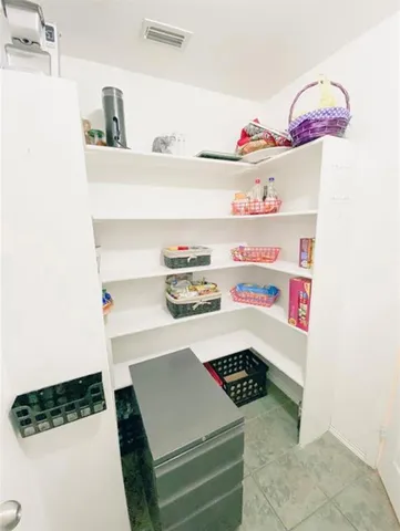 a kitchen with a cabinets and window