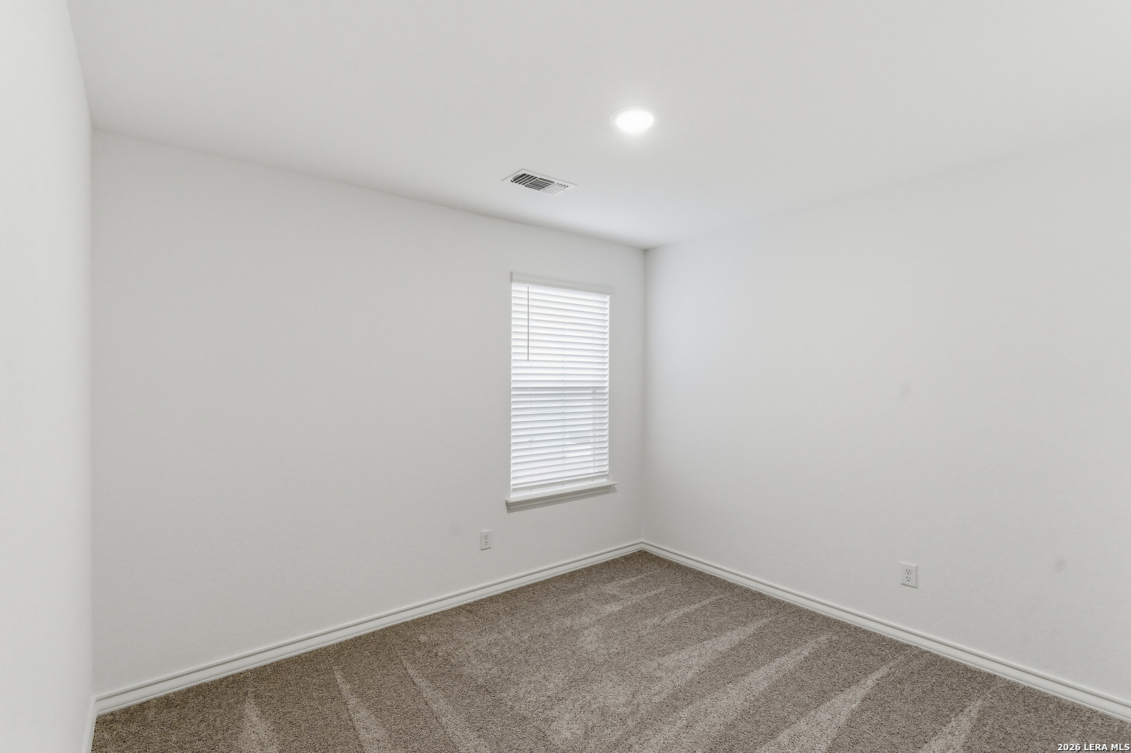 10107 Monte Carmel Place Adkins, TX 78101 - Photo 14 of 25 an empty room with window