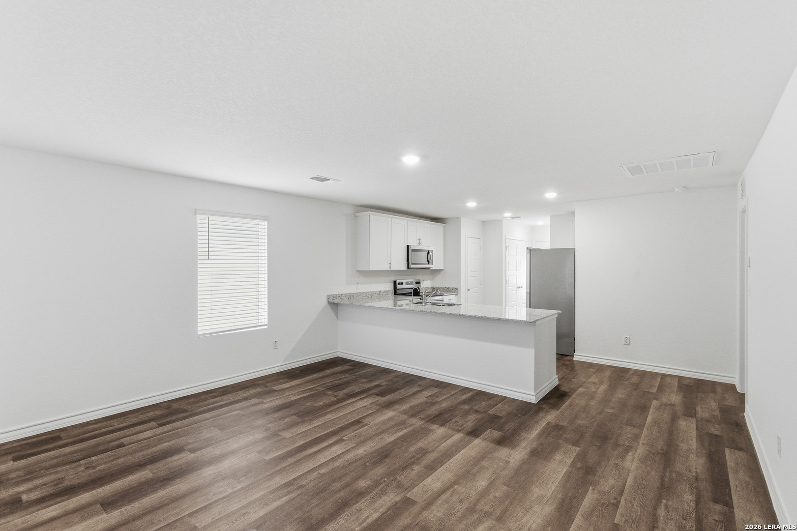 10107 Monte Carmel Place Adkins, TX 78101 - Photo 2 of 25 a view of kitchen with wooden floor and electronic appliances