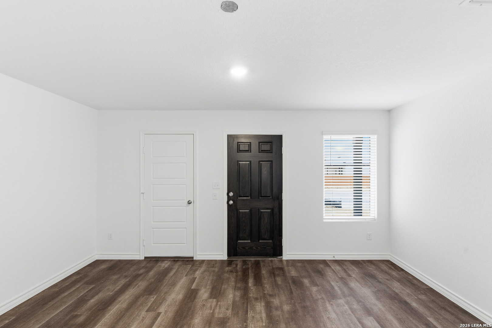 10107 Monte Carmel Place Adkins, TX 78101 - Photo 21 of 25 an empty room with closet and windows