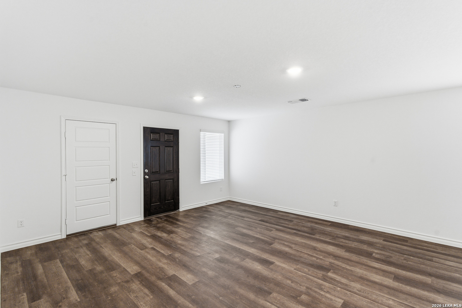 10107 Monte Carmel Place Adkins, TX 78101 - Photo 22 of 25 a view of an empty room with wooden floor