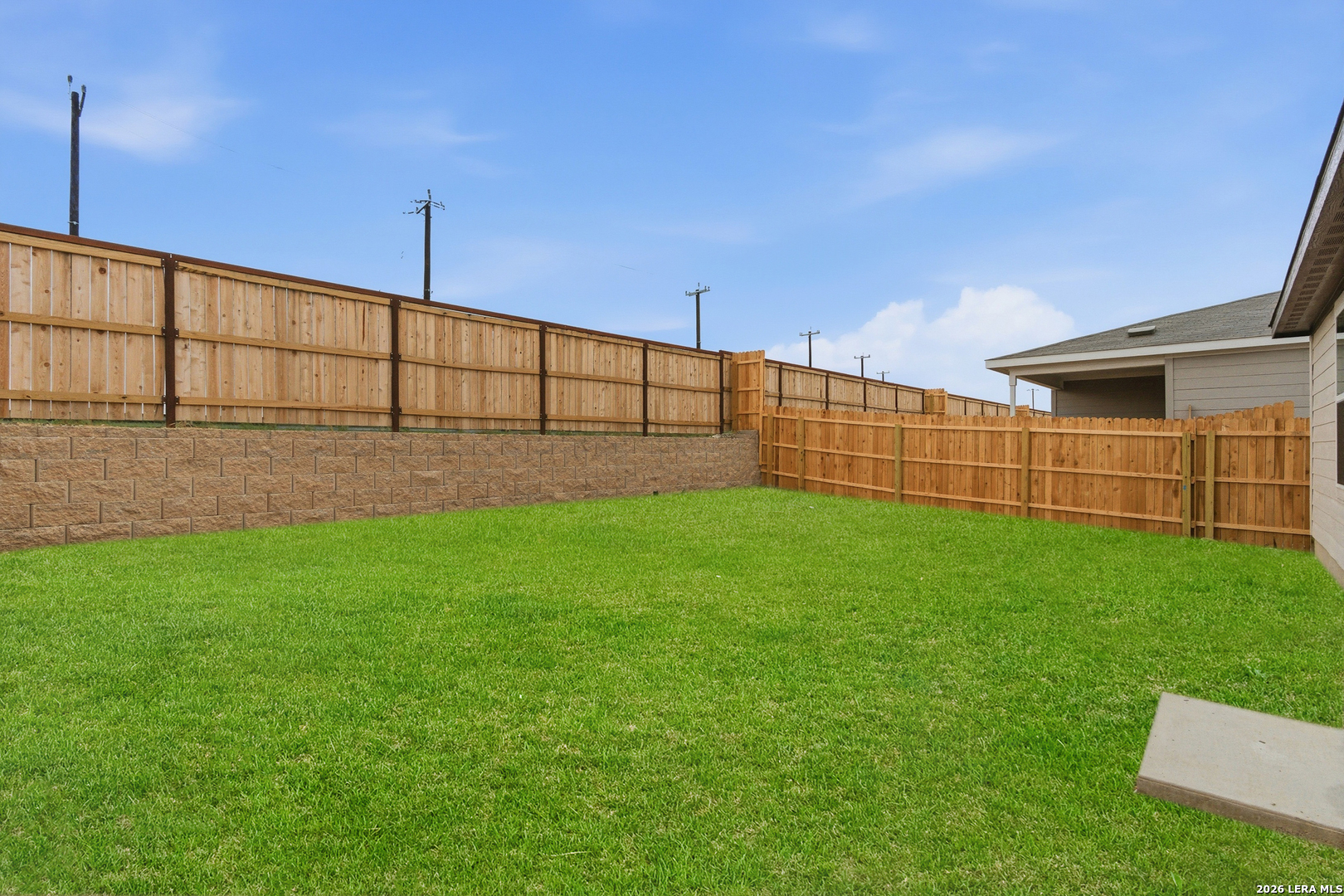 10107 Monte Carmel Place Adkins, TX 78101 - Photo 23 of 25 a view of a backyard with a garden and plants