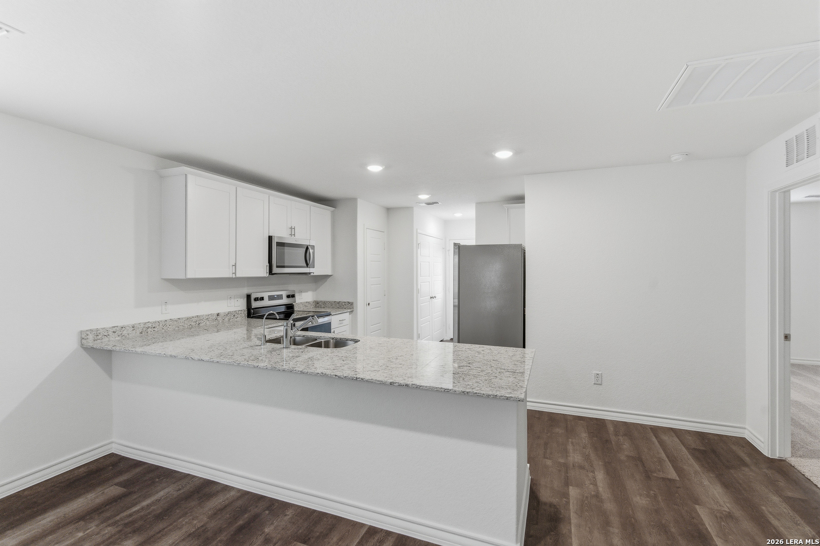 10107 Monte Carmel Place Adkins, TX 78101 - Photo 5 of 25 a bathroom with a sink and a mirror