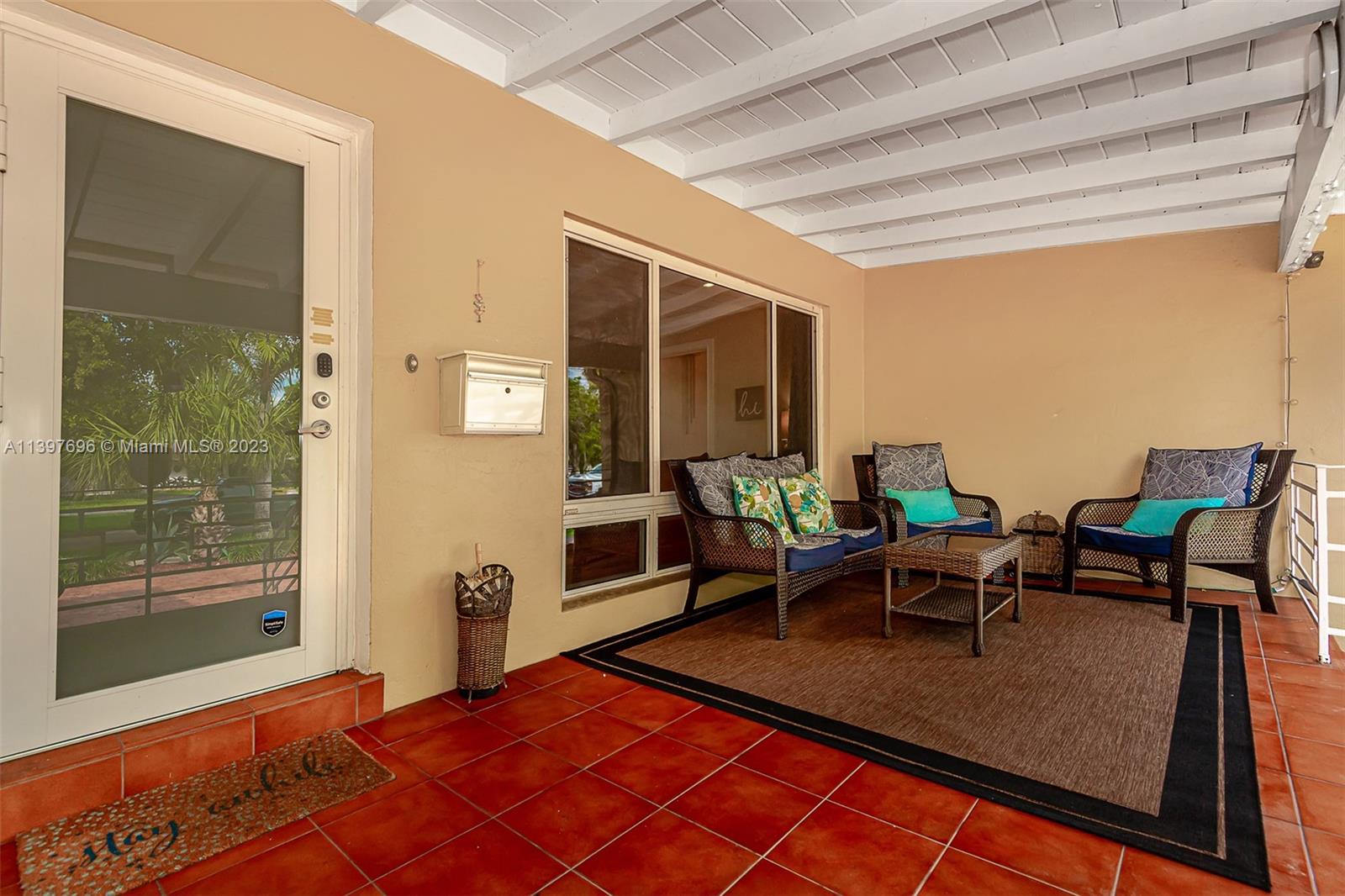 307 North Rainbow Drive Hollywood, FL 33021 - Photo 15 of 74 a dining room with furniture and a rug