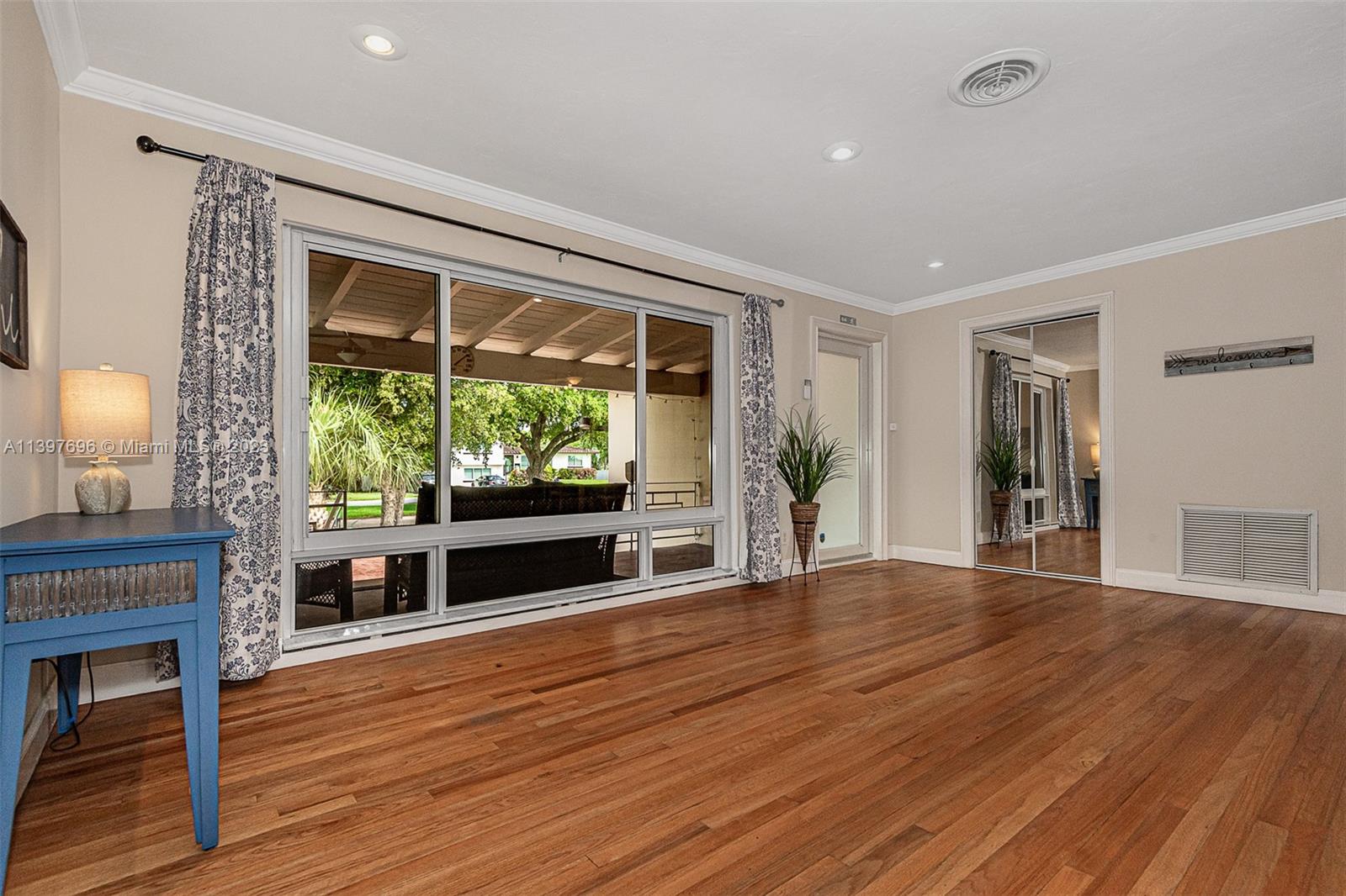 307 North Rainbow Drive Hollywood, FL 33021 - Photo 17 of 74 a view of empty room with wooden floor and fireplace