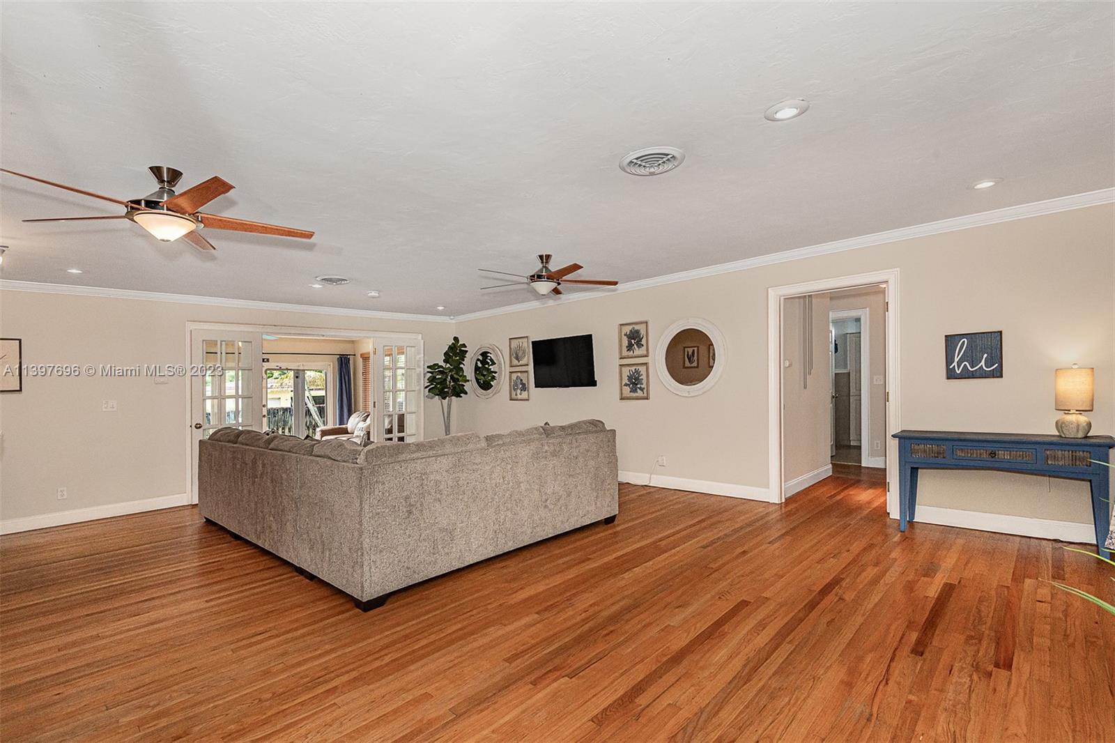 307 North Rainbow Drive Hollywood, FL 33021 - Photo 20 of 74 a living room with furniture and a wooden floor