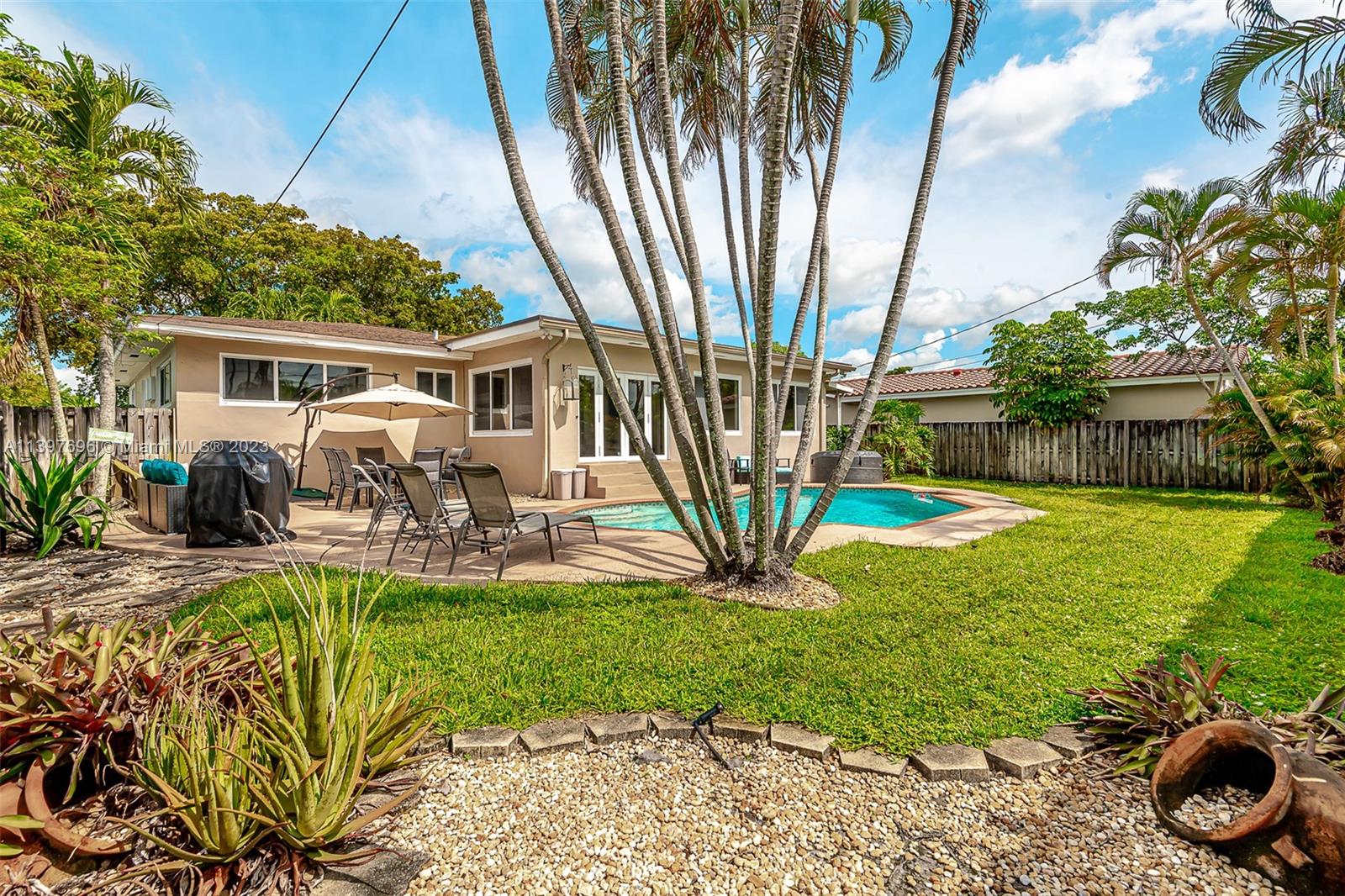 307 North Rainbow Drive Hollywood, FL 33021 - Photo 2 of 74 a view of a house with backyard and sitting area