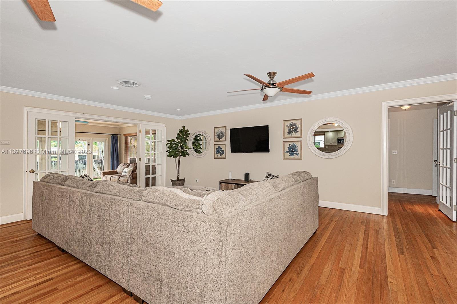 307 North Rainbow Drive Hollywood, FL 33021 - Photo 22 of 74 a living room with furniture and a flat screen tv