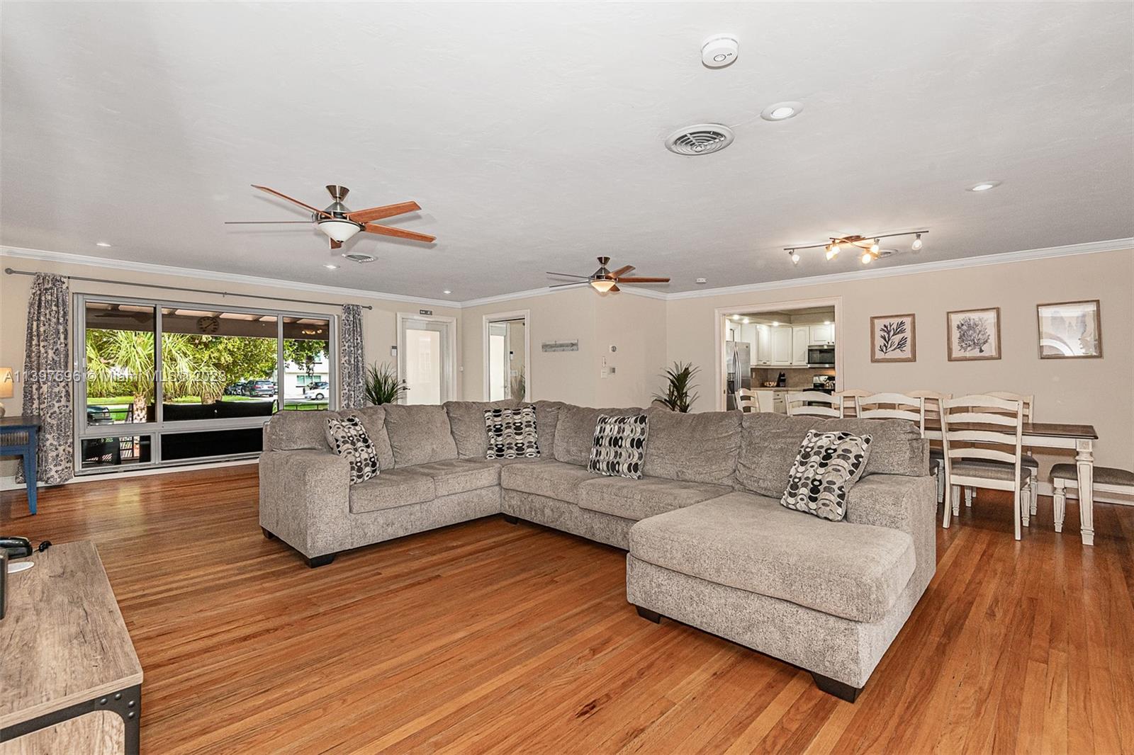 307 North Rainbow Drive Hollywood, FL 33021 - Photo 23 of 74 a living room with furniture and a wooden floor