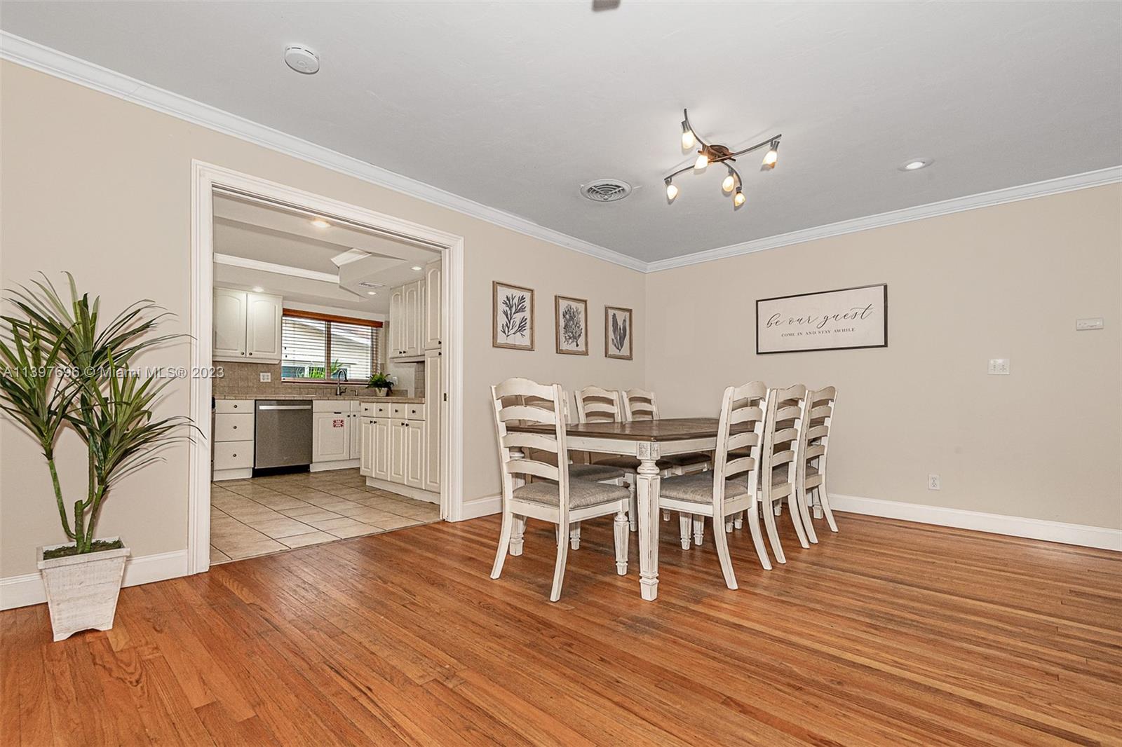 307 North Rainbow Drive Hollywood, FL 33021 - Photo 24 of 74 a view of a dining room with furniture and wooden floor
