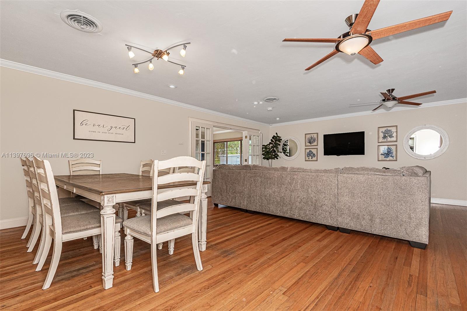 307 North Rainbow Drive Hollywood, FL 33021 - Photo 25 of 74 a living room with furniture and a flat screen tv