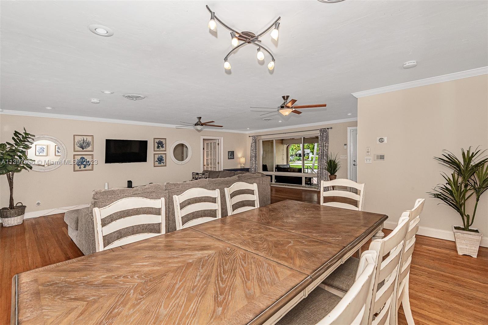 307 North Rainbow Drive Hollywood, FL 33021 - Photo 26 of 74 a living room with furniture kitchen view and a large window
