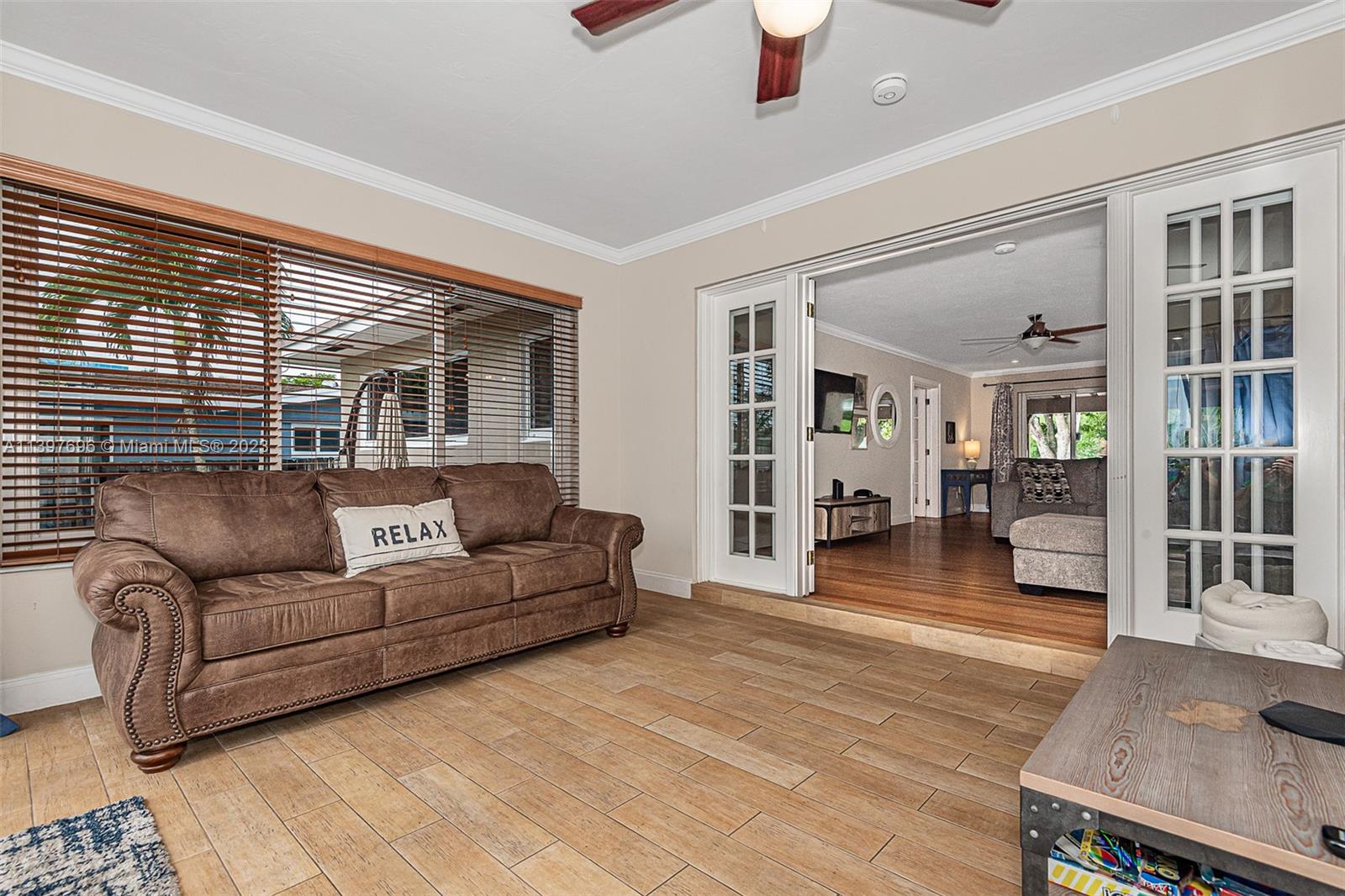 307 North Rainbow Drive Hollywood, FL 33021 - Photo 31 of 74 a living room with furniture and a wooden floor