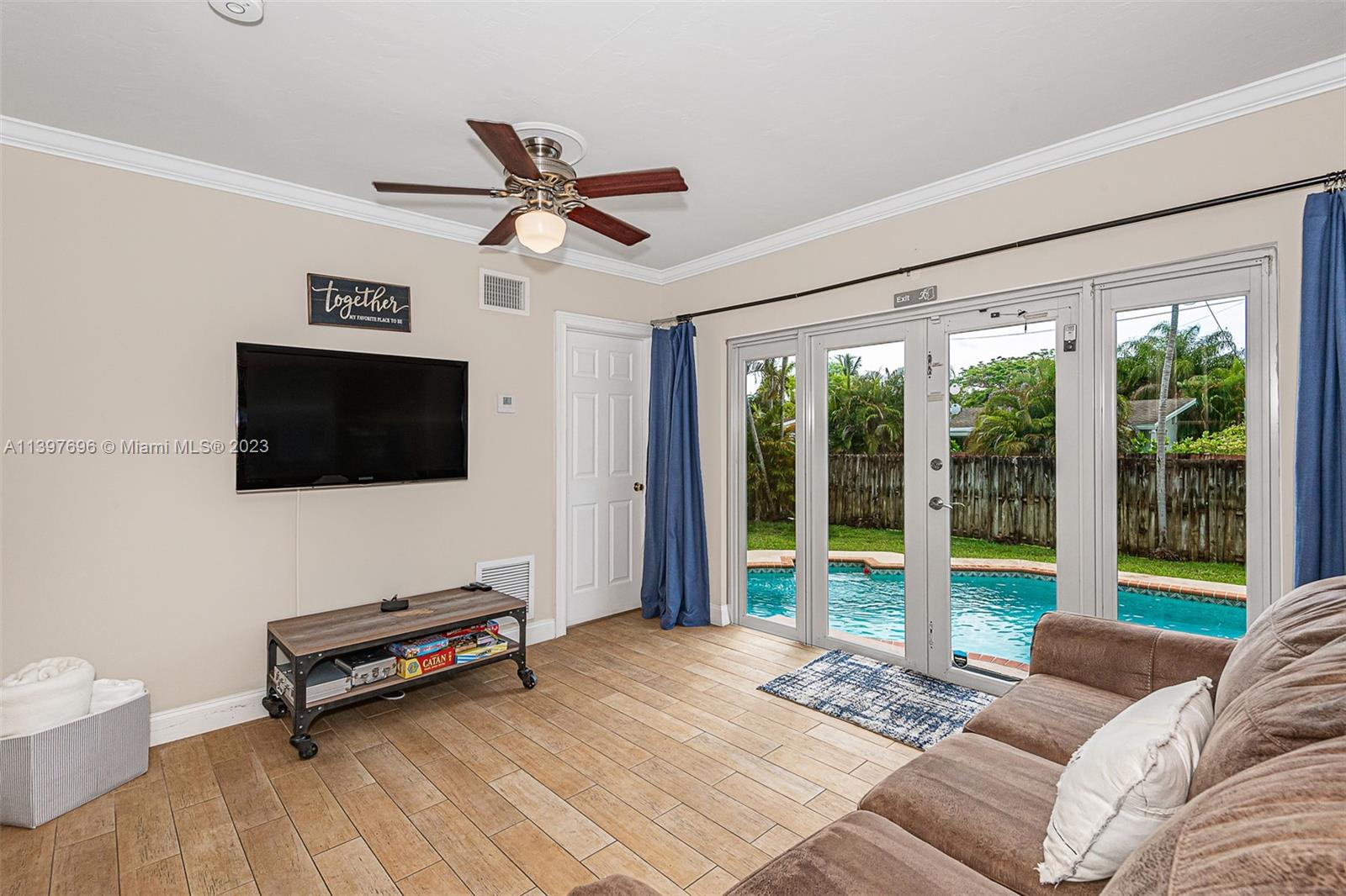 307 North Rainbow Drive Hollywood, FL 33021 - Photo 33 of 74 a bedroom with furniture and a flat screen tv