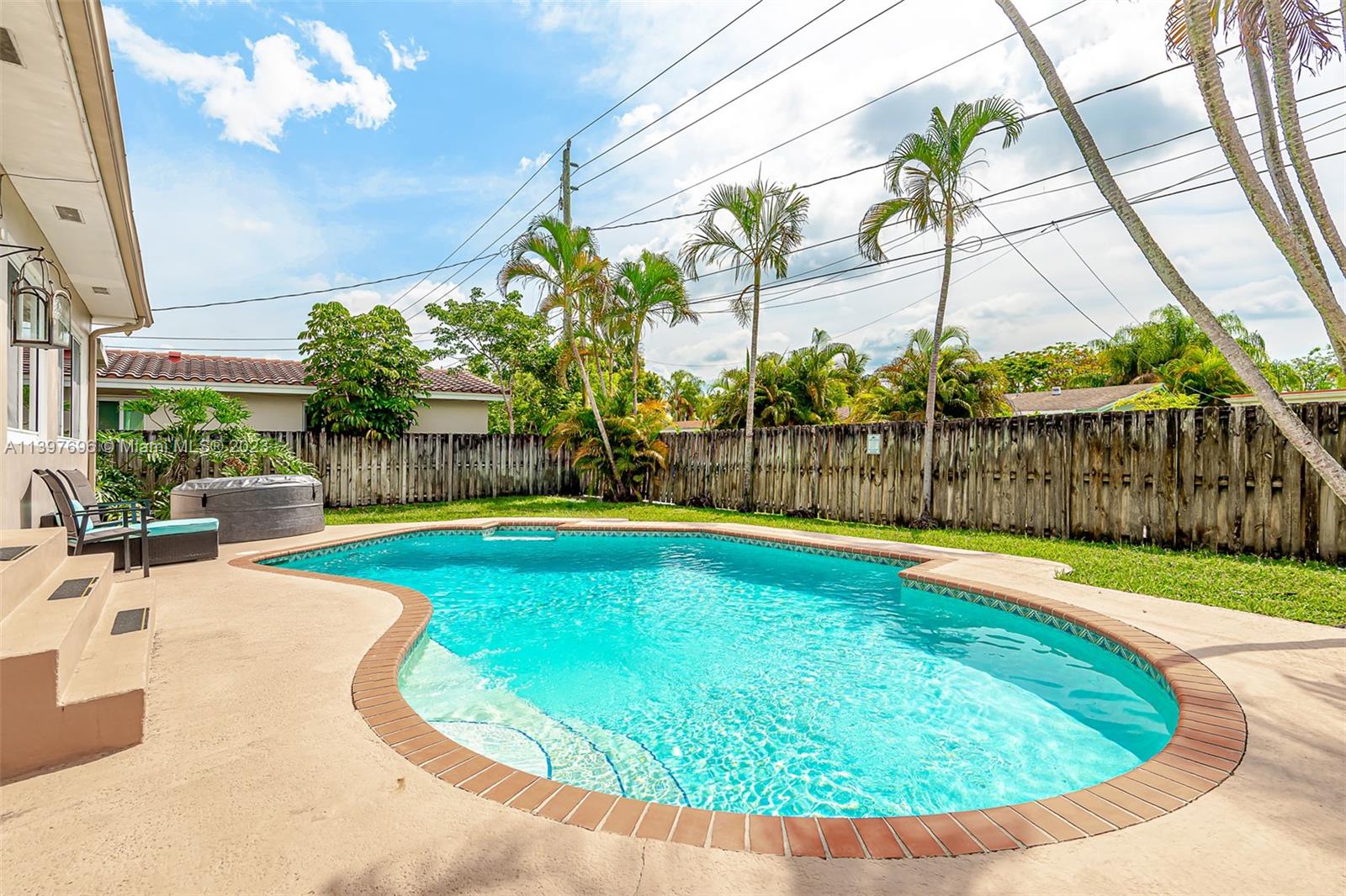 307 North Rainbow Drive Hollywood, FL 33021 - Photo 37 of 74 a view of a swimming pool with a patio