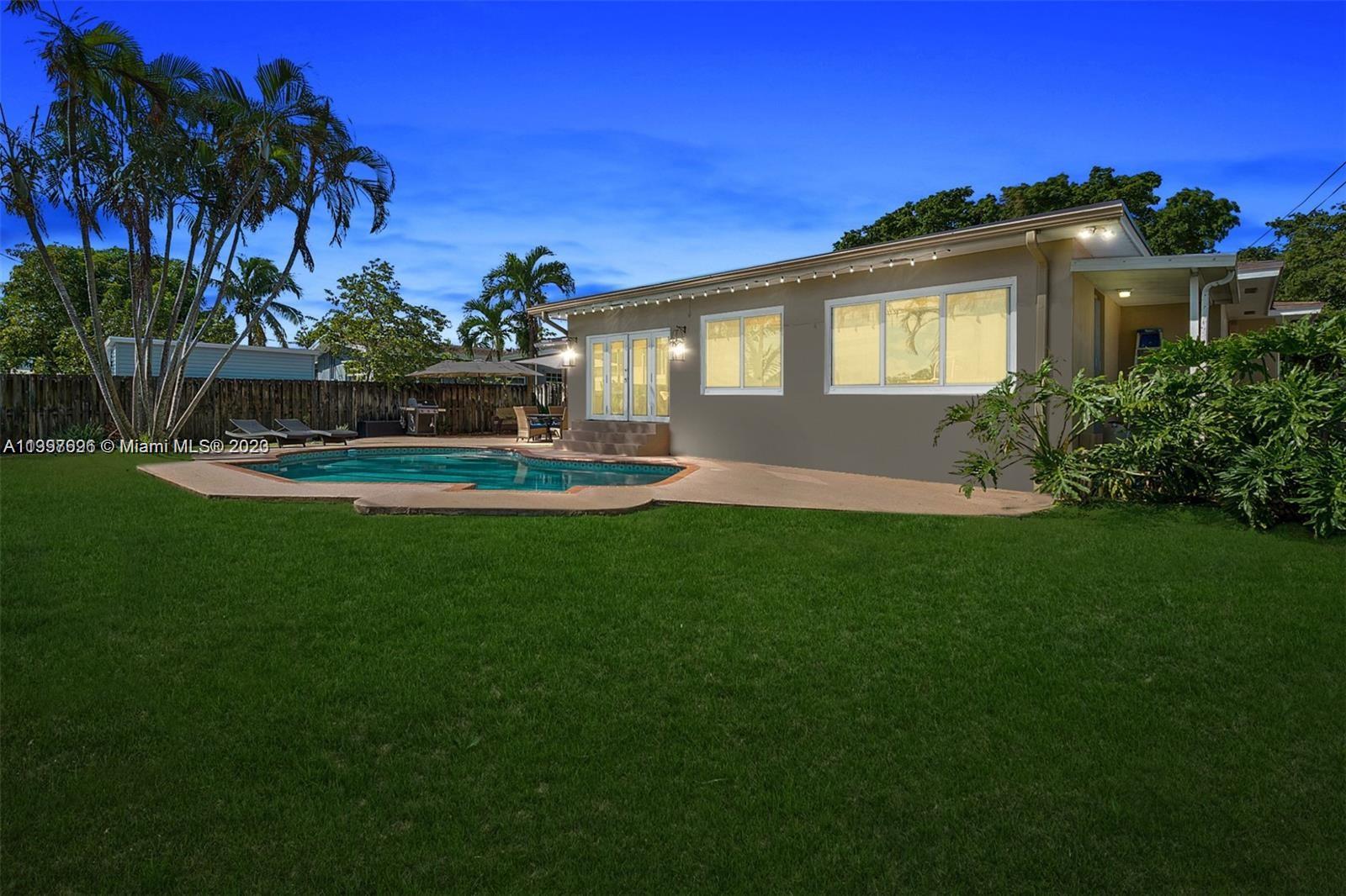 307 North Rainbow Drive Hollywood, FL 33021 - Photo 44 of 74 a front view of a house with a yard