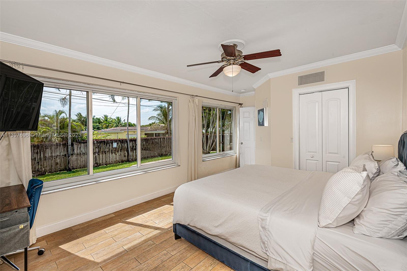 307 North Rainbow Drive Hollywood, FL 33021 - Photo 56 of 74 a bedroom with a large bed and a large window