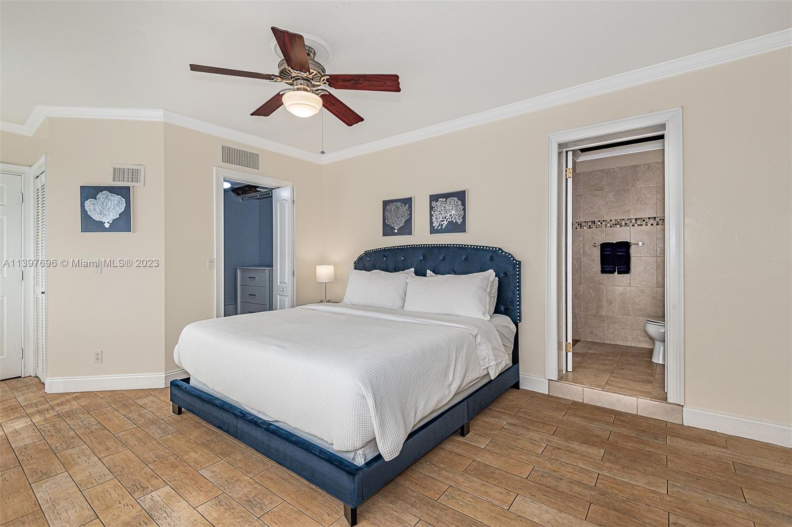 307 North Rainbow Drive Hollywood, FL 33021 - Photo 57 of 74 a bedroom with a bed and a ceiling fan