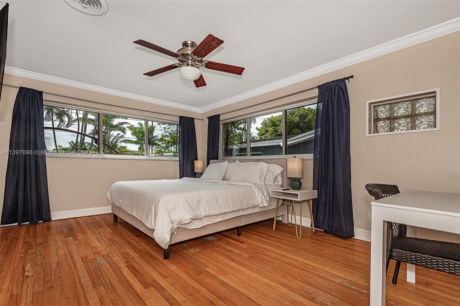 307 North Rainbow Drive Hollywood, FL 33021 - Photo 61 of 74 a bedroom with a bed and a large window