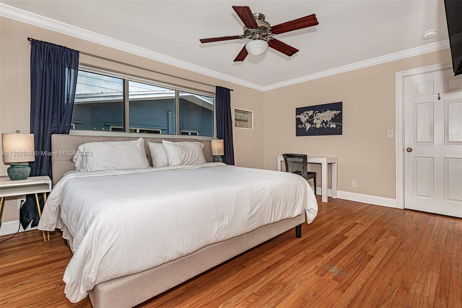 307 North Rainbow Drive Hollywood, FL 33021 - Photo 62 of 74 a bedroom with a large bed and a window