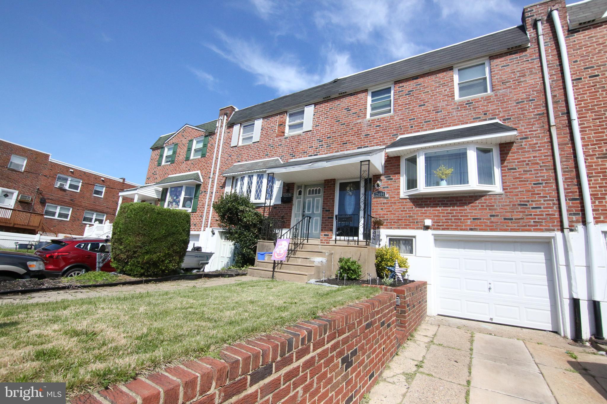12604 Medford Road Philadelphia, PA 19154 - Photo 2 of 28 a front view of a house with a yard