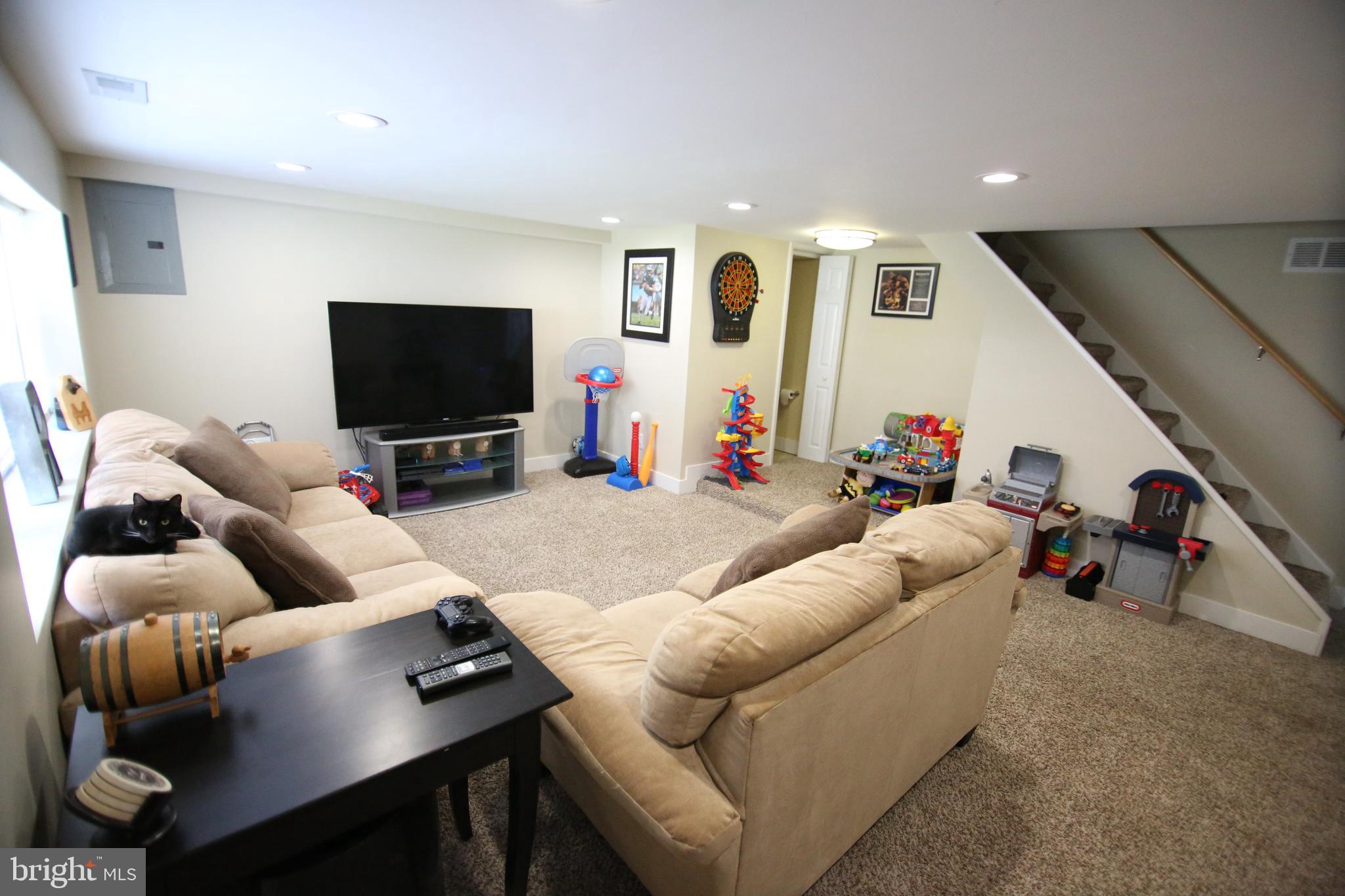 12604 Medford Road Philadelphia, PA 19154 - Photo 13 of 28 a living room with furniture and a flat screen tv