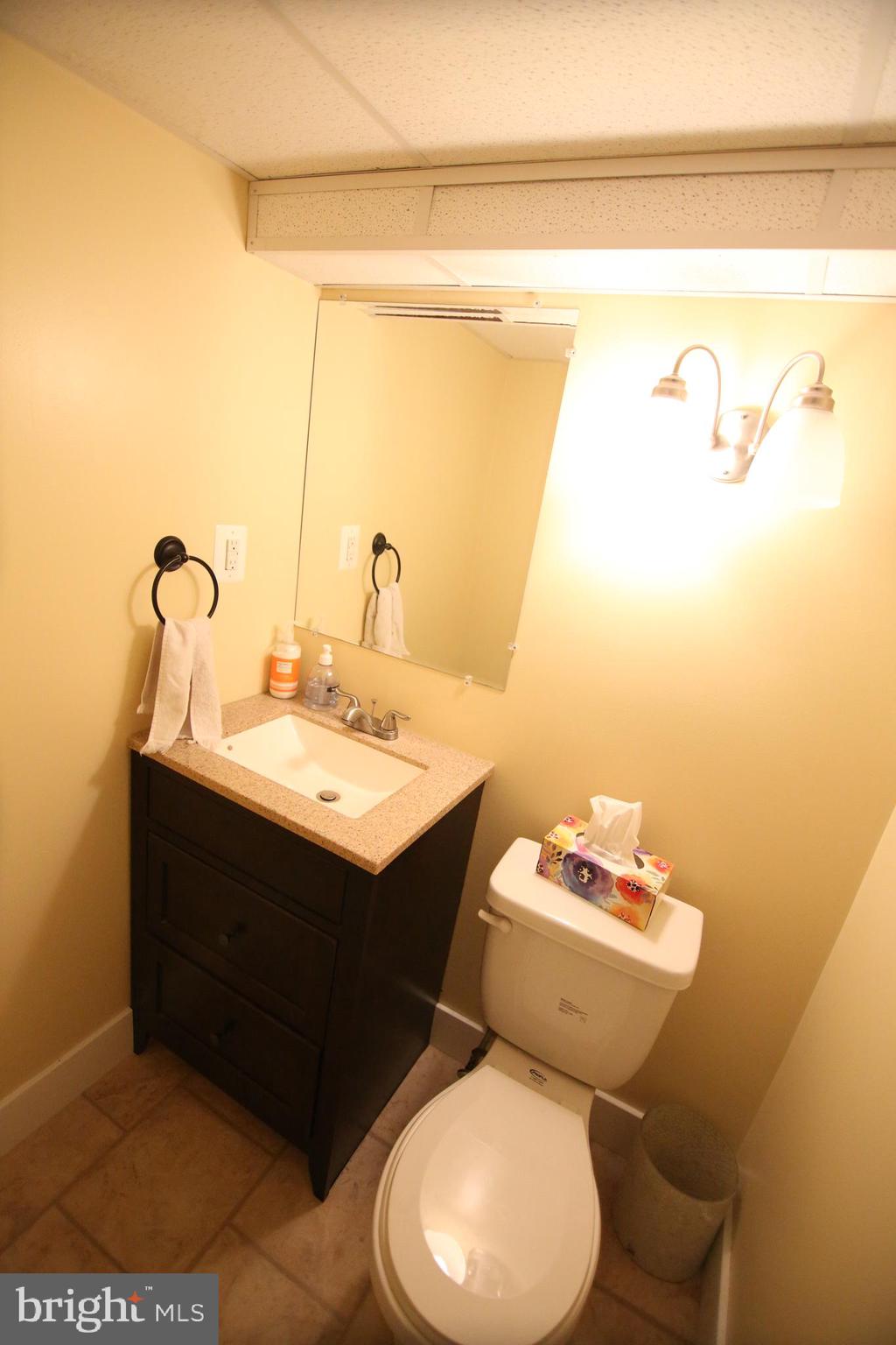 12604 Medford Road Philadelphia, PA 19154 - Photo 14 of 28 a bathroom with a sink mirror and toilet