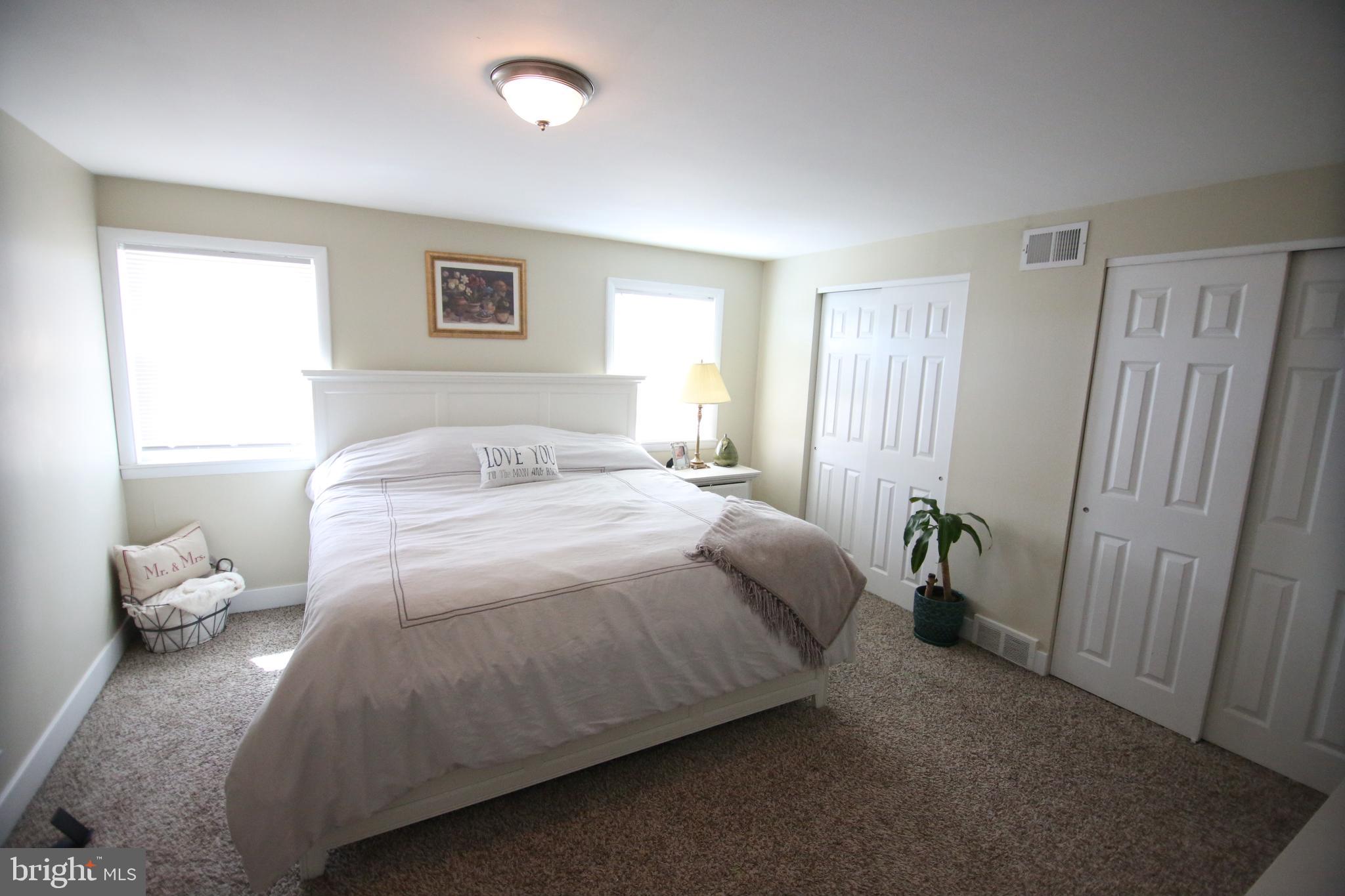 12604 Medford Road Philadelphia, PA 19154 - Photo 19 of 28 a bedroom with a bed and a window