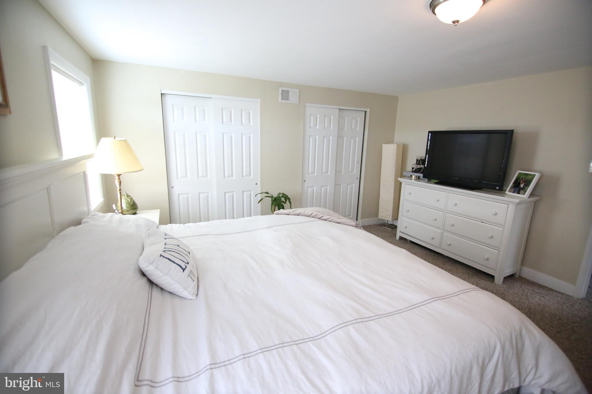 12604 Medford Road Philadelphia, PA 19154 - Photo 20 of 28 a bedroom with a bed and a flat screen tv