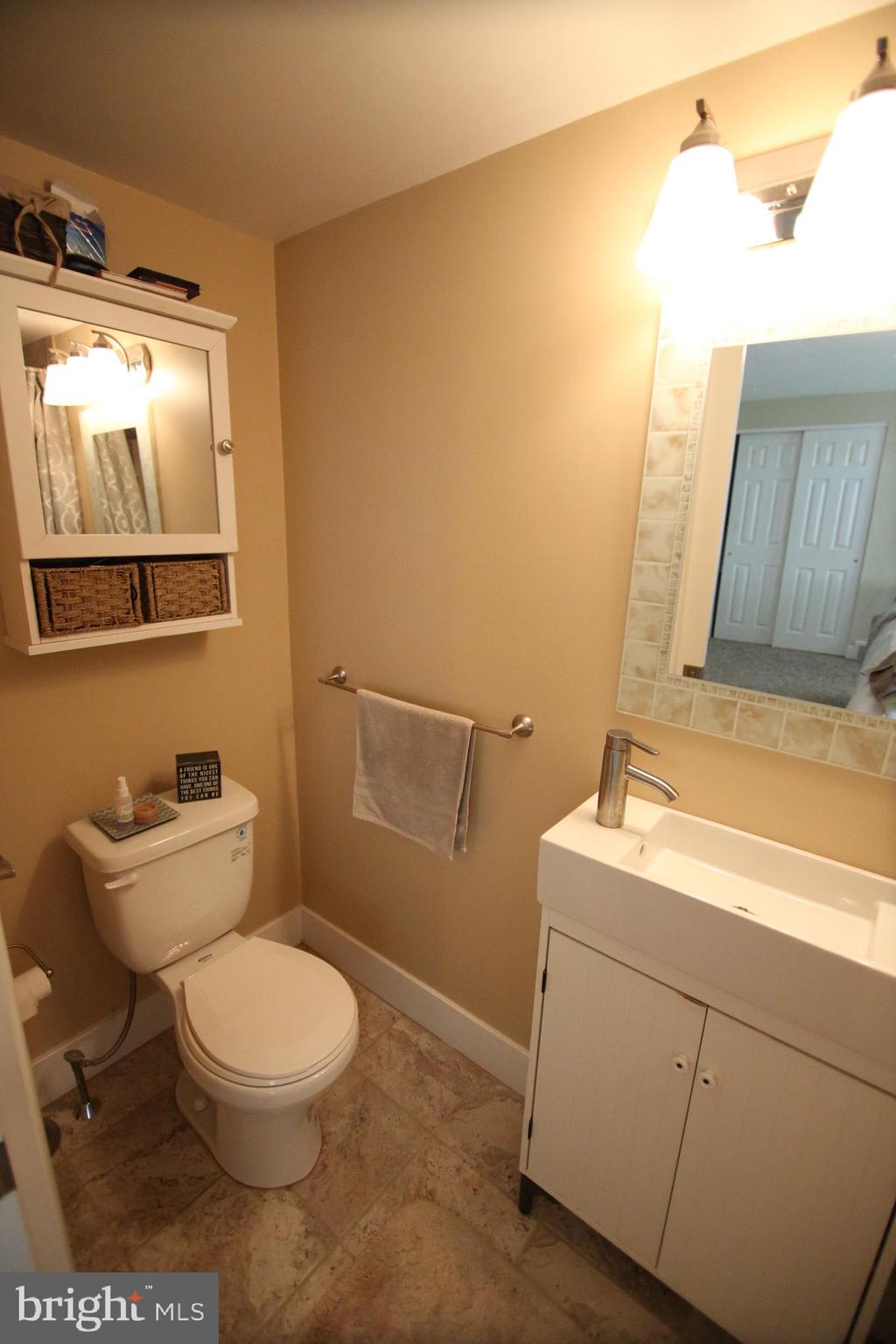 12604 Medford Road Philadelphia, PA 19154 - Photo 22 of 28 a bathroom with a toilet a sink and mirror