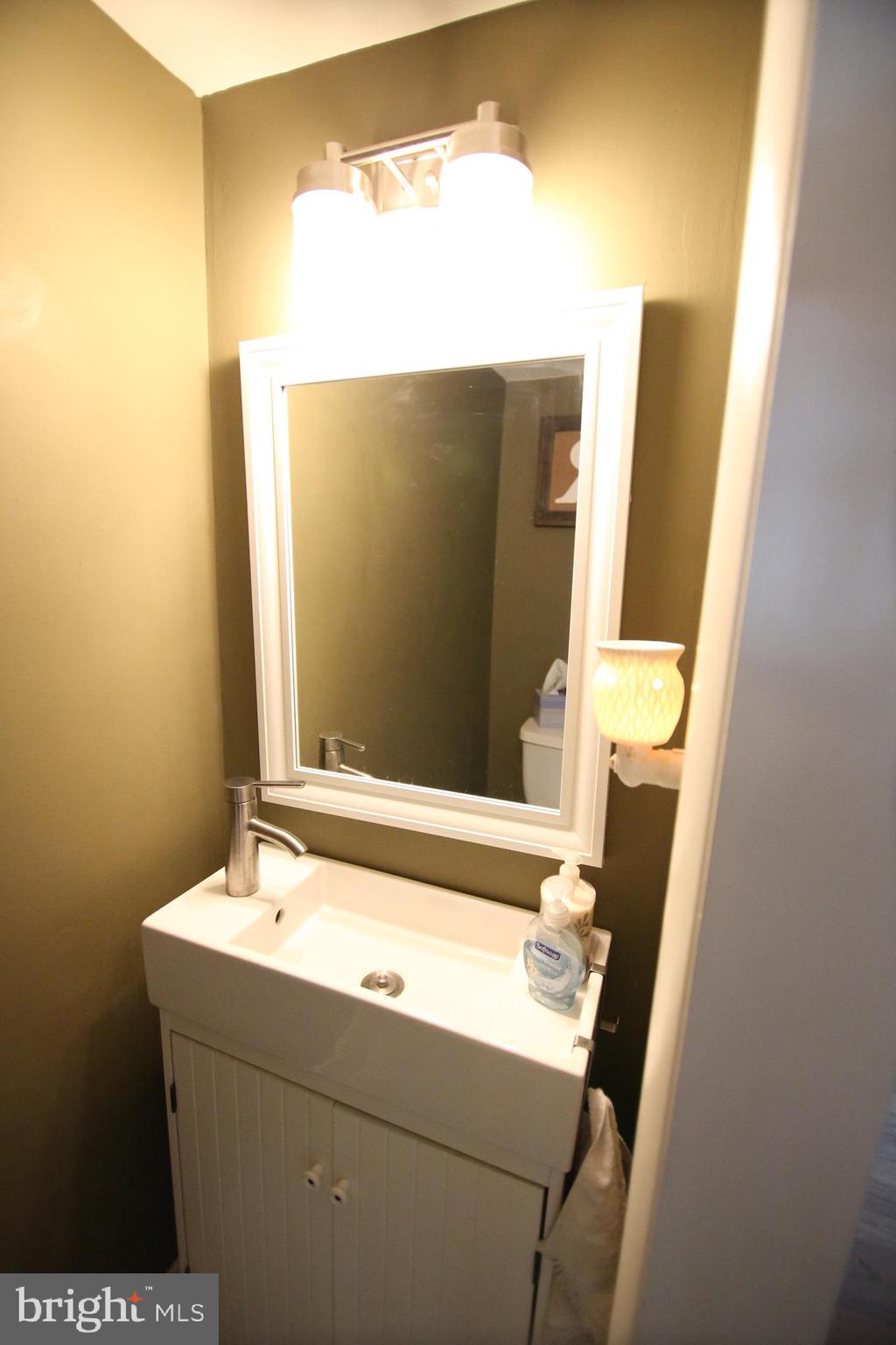 12604 Medford Road Philadelphia, PA 19154 - Photo 7 of 28 a bathroom with a sink and a mirror
