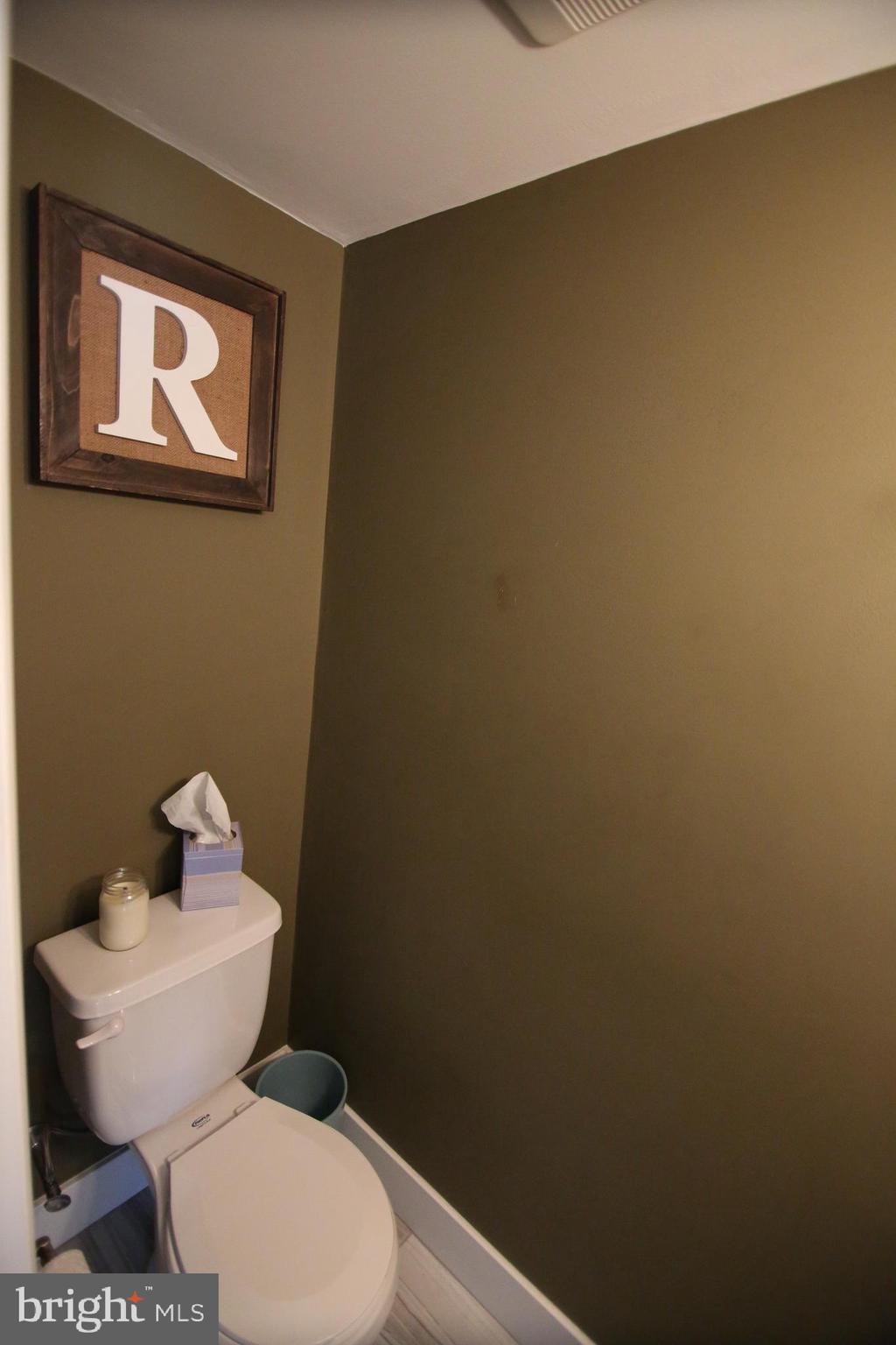 12604 Medford Road Philadelphia, PA 19154 - Photo 8 of 28 a white toilet sitting next to a white sink and vanity