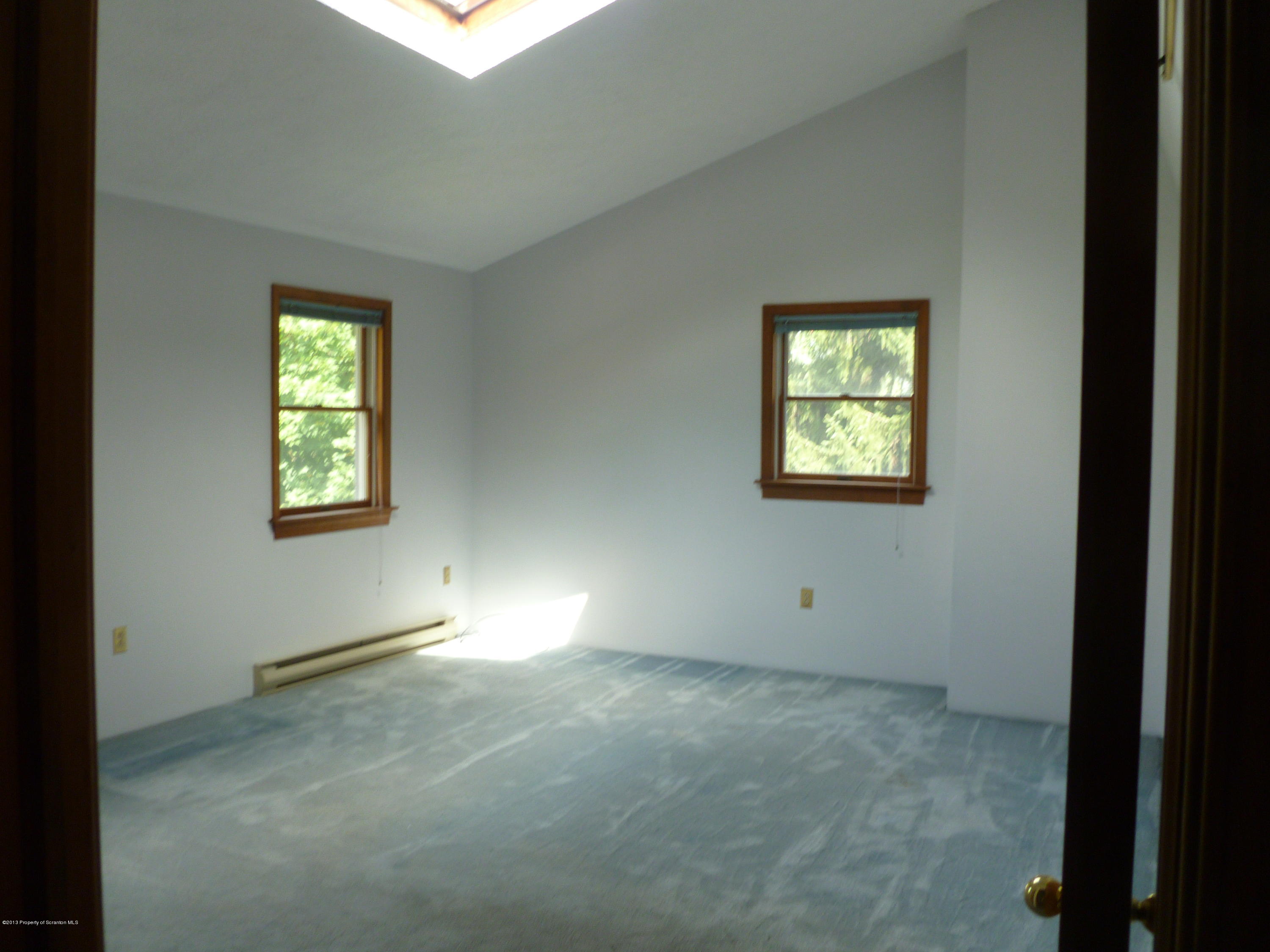 1250 Aberdeen Road Moscow, PA 18444 - Photo 4 of 32 an empty room with windows