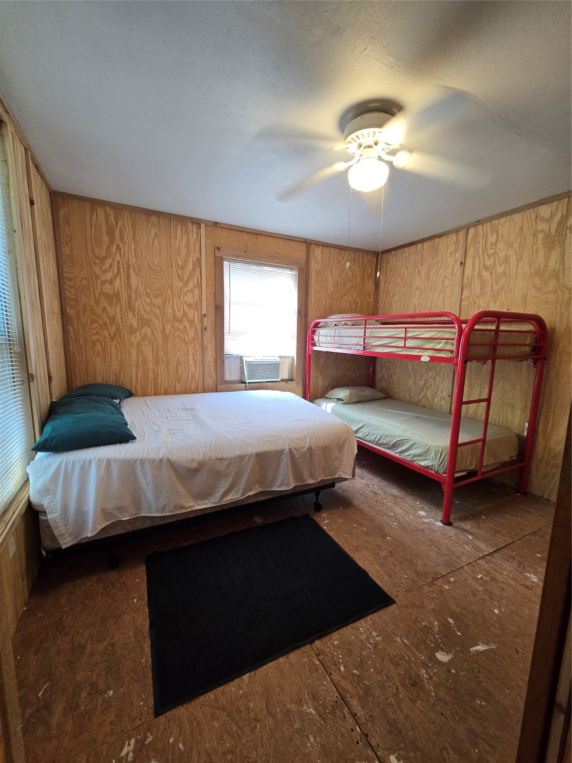 206 Tallow Street Onalaska, TX 77360 - Photo 12 of 25 a bedroom with a bed and window
