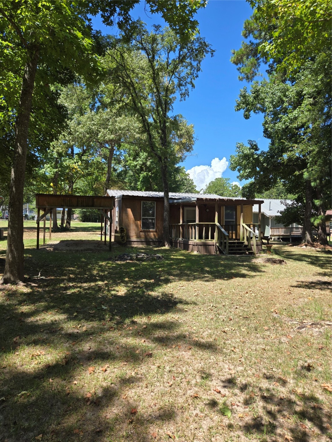 206 Tallow Street Onalaska, TX 77360 - Photo 15 of 25 a view of house with outdoor space