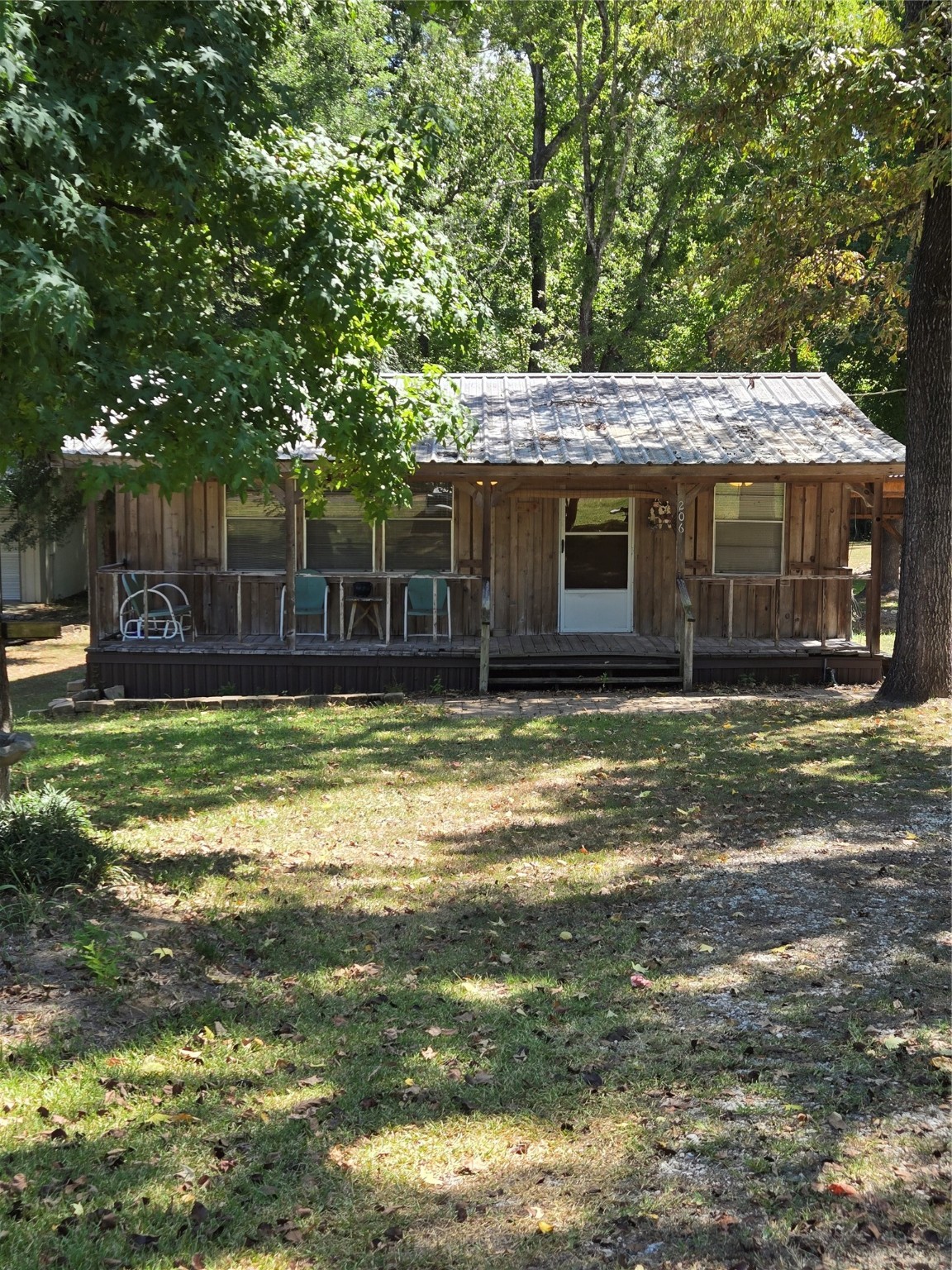 206 Tallow Street Onalaska, TX 77360 - Photo 25 of 25 a view of a house with a yard