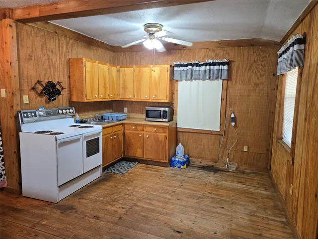 a view of a fireplace with wooden floor